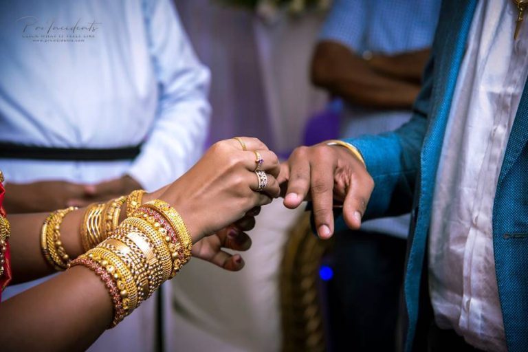 Bride and groom exchanging rings during wedding